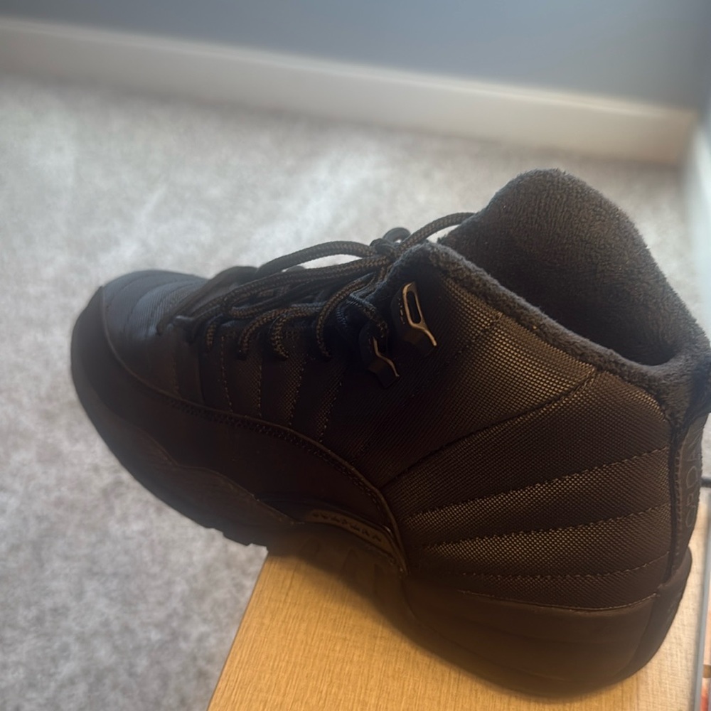 Lightly worn black Jordan 12 Winter (Sz 7Y)
